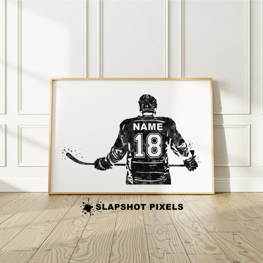 Personalized hockey poster showing back of hockey player with custom name and number on the hockey jersey. Designed in watercolor splatters. Perfect hockey gifts for boys, hockey team gifts, hockey coach gift, hockey wall art décor in a hockey bedroom and birthday gifts for hockey players.